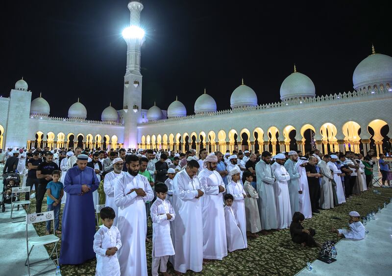 Isha prayers were held at the Sheikh Zayed Grand Mosque in Abu Dhabi on Tuesday. All photos: Victor Besa / The National