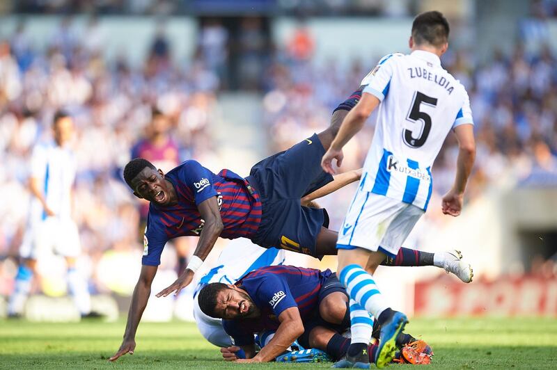 Barcelona's Ousmane Dembele receives some rough treatment from Real Sociedad. Getty Images