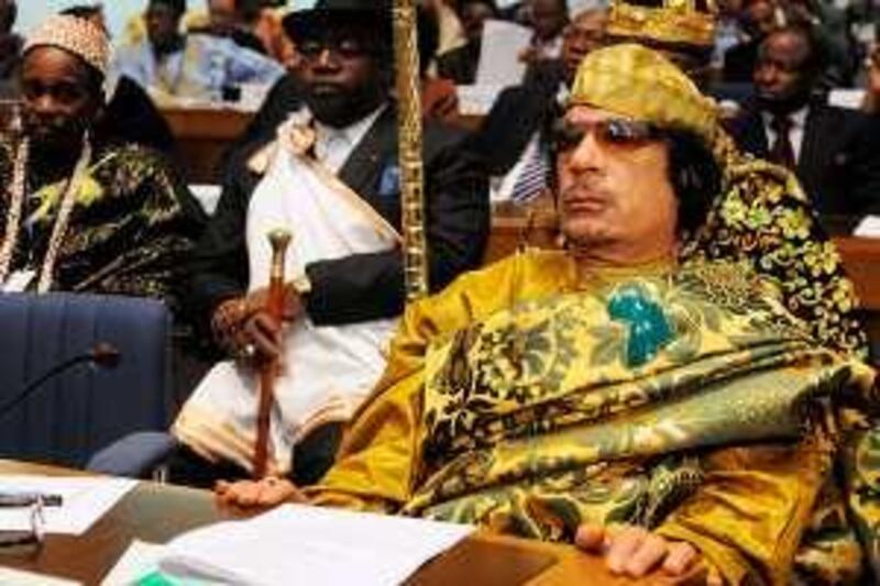 Libyan leader Moamer Kadhafi (R) attends the opening of the African heads of State summit on February 2, 2009 in Addis Ababa. Kadhafi was elected chairman of the African Union on February 2, 2009 at a summit of the 53-nation bloc in the Ethiopian capital. The African Union opened a summit on February 1, 2009 officially devoted to developing transport and energy systems, but dominated by conflicts across the region and division over the bloc's future. AFP PHOTO/SIMON MAINA