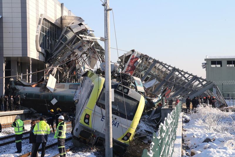 Firefighters and medics try to rescue victims after a high speed train accident in Ankara, Turkey. EPA