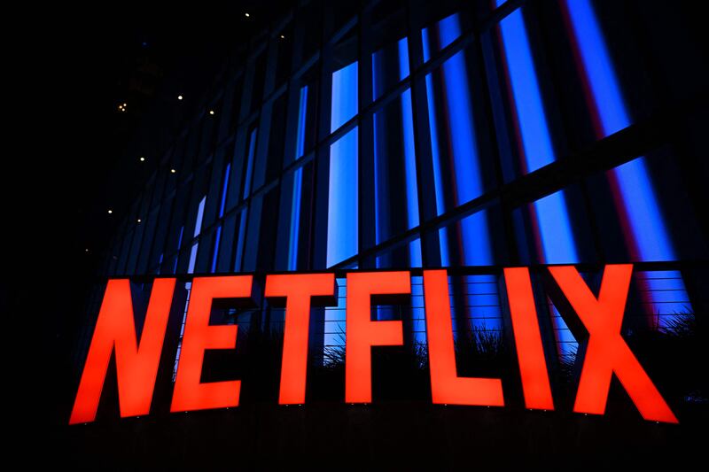 With the launch of cheaper, ad-supported subscriptions, Netflix is expected to bite into the revenue of traditional television channels as the streaming services look toward continued expansion. AFP
