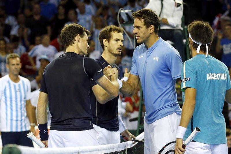 Juan Martin del Potro, second right, has played over eight hours of tennis in the past two days to help Argentina to a 2-1 lead in their Davis Cup semi-final with Great Britain. Andrew Boyers / Reuters

