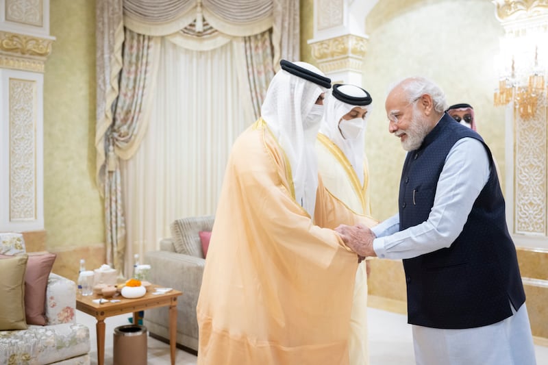 Sheikh Hamed bin Zayed, managing director of Abu Dhabi Investment Authority and member of Abu Dhabi Executive Council, shakes hands with Mr Modi.