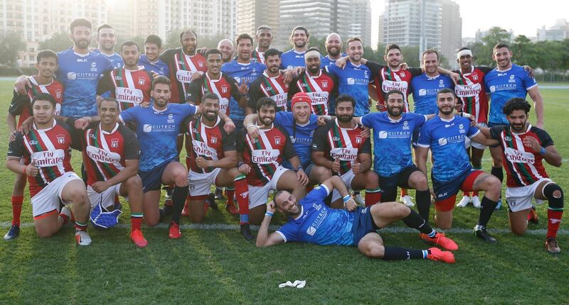 Players of Israel, blue, and UAE after a friendly rugby match in Dubai on Friday, March 19. The Israeli team travelled to the country for a joint training camp with the UAE national squad and their first ever rugby match. EPA