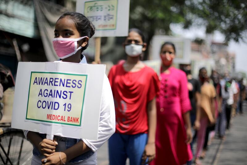 Volunteers take part in a Covid-19 awareness rally to mark World Health Day, in Kolkata, India, on April 7, 2021. EPA