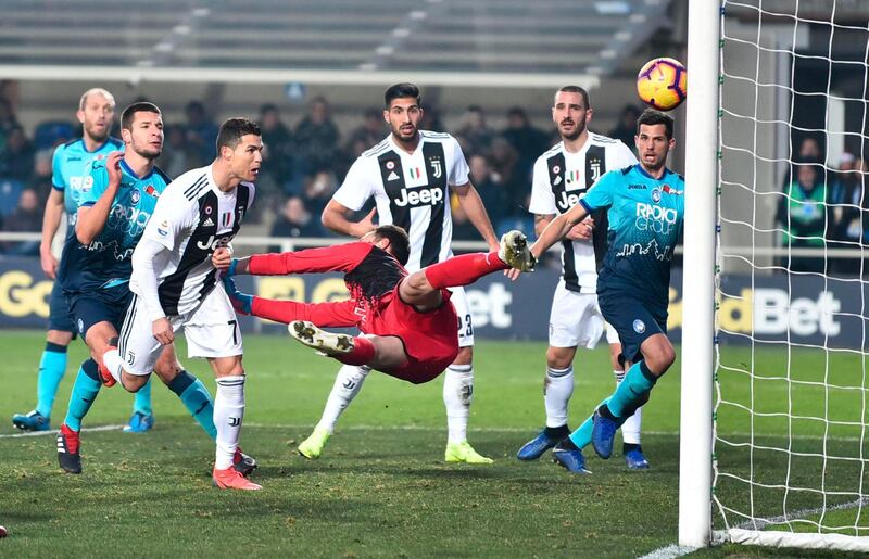 Juventus' Cristiano Ronaldo, third from left, scores his side's second goal during the Serie A soccer match between Atalanta and Juventus in Bergamo, Italy.  AP