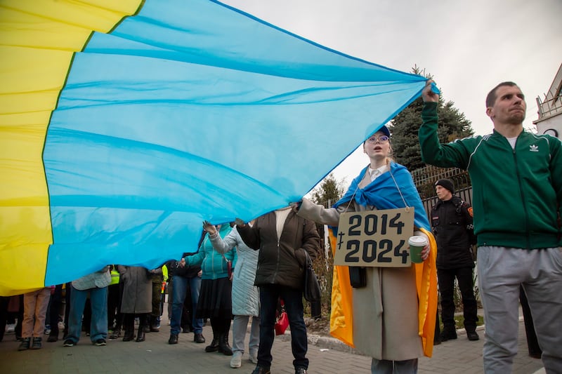 Ukrainian citizen and anti-war activists holding Moldovan and Ukrainian flags at a protest in front of the Russian embassy, in Chisinau, Moldova. EPA