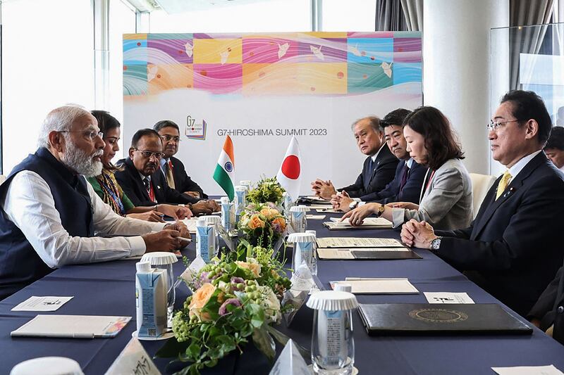 India's Prime Minister Narendra Modi, left, and Japan's Prime Minister Kishida Fumio, right, in a bilateral meeting on the sidelines of the G7 Summit in Hiroshima. AFP