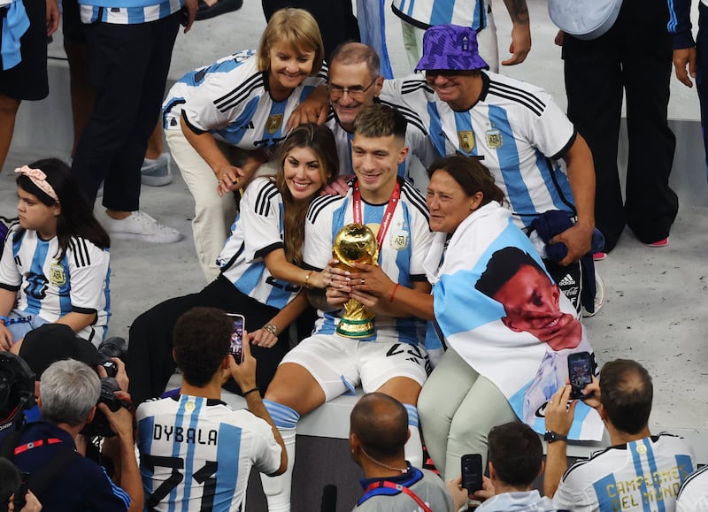 Argentina's Lisandro Martinez and his loved ones cherish the moment. Reuters