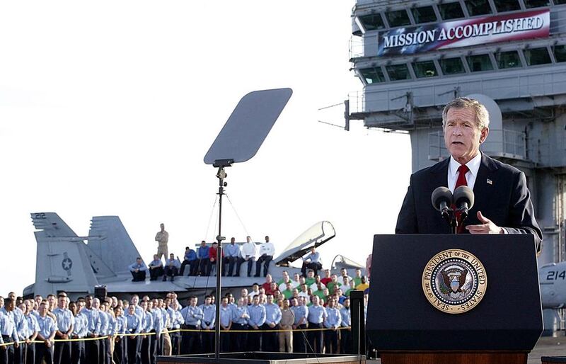 US President George W Bush addresses the nation aboard the nuclear aircraft carrier USS Abraham Lincoln in May 2013. Stephan Jaffe / AFP Photo