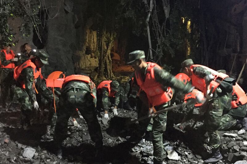 Chinese paramilitary police search for survivors after the earthquake in Jiuzhaigou in southwest China's Sichuan province. AFP