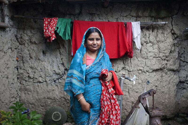 Josna Hossian, wife of Belal Hossian poses at her home. Suvra Kanti Das / AFP