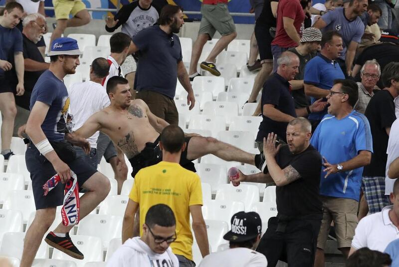 Clashes break out in the stands after the Euro 2016 Group B soccer match between England and Russia, at the Velodrome stadium in Marseille, France. Thanassis Stavrakis / AP