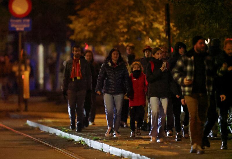 People walk outside King Baudouin Stadium after play was suspended following the shooting. Reuters