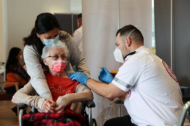 A woman receives her vaccination against Covid-19 at an assisted living facility, in Netanya, Israel, January 19. Reuters