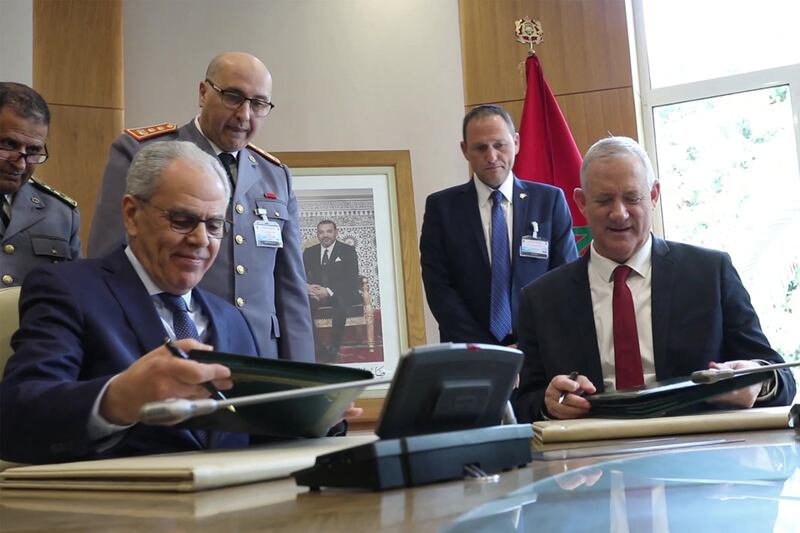 Israeli Defence Minister Benny Gantz, right, signs a defence agreement with Abdellatif Loudiyi, Morocco's minister delegate in charge of national defence administration during a meeting in November 2021. AFP