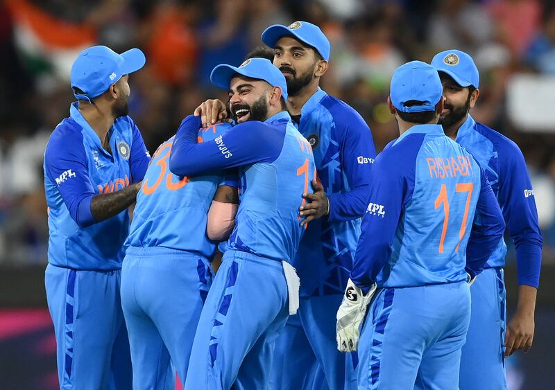 Virat Kohli congratulates Hardik Pandya on taking the wicket of Craig Ervine of Zimbabwe. Getty 