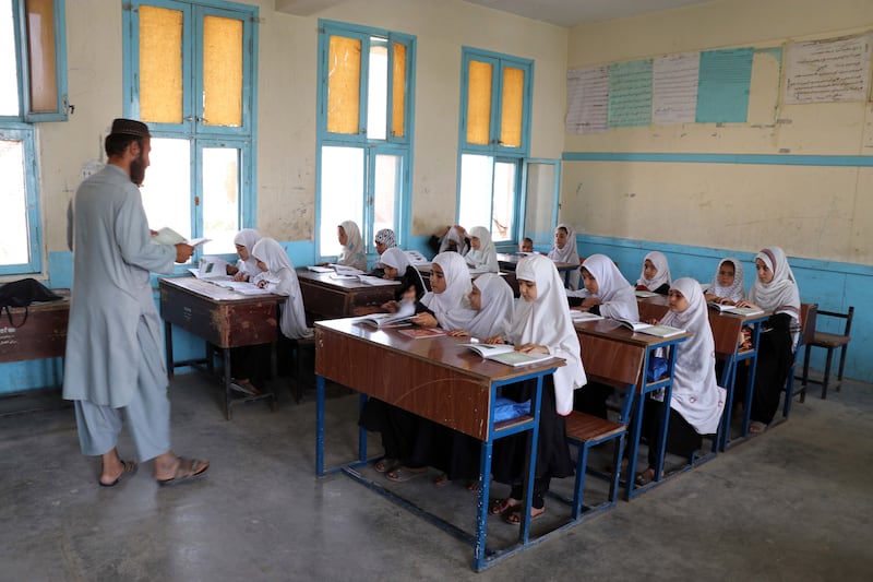 Afghan girls attend a class in Kandahar, on September 18. The Taliban last year announced the reopening of schools for boys at all levels, while for girls it was limited to primary education. EPA