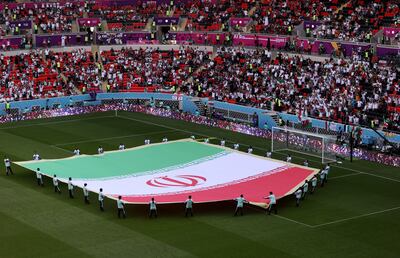 A giant Iranian flag on the pitch prior to the World Cup match between Wales and Iran at the Ahmad bin Ali Stadium, in Umm Al Afaei. Getty