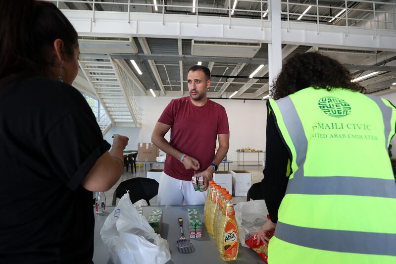 Ahmed Ali, volunteer co-ordinator, packs items at a donation drive for earthquake survivors at Alserkal Avenue, in Dubai. All photos: Chris Whiteoak / The National