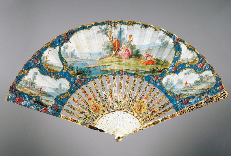 FRANCE - SEPTEMBER 09: Hand fan with gallant scenes and landscapes, tempera painted on paper, carved and painted ivory ribs, ca 1760. France, 18th century. Modena, Museo Civico D'Arte (Art Museum) Palazzo Dei Musei France (Photo by DeAgostini/Getty Images)