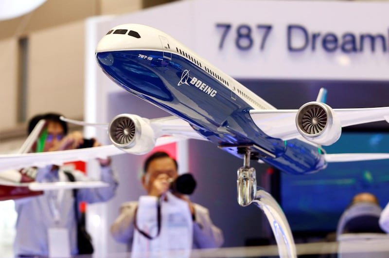 FILE PHOTO: Visitors take pictures of a model of Boeing's 787 Dreamliner during Japan Aerospace 2016 air show in Tokyo, Japan, October 12, 2016.   REUTERS/Kim Kyung-Hoon/File Photo