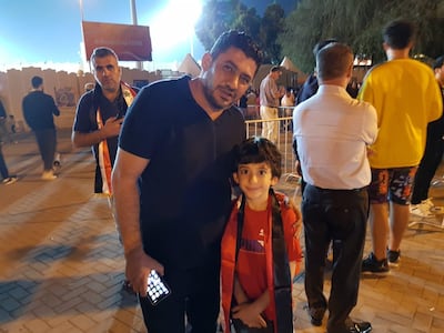 Chamil Al Akabani, a 41-year-old Dubai based businessman, pictured outside the Sharjah Football Stadium with his eight-year-old son Alan. They had been waiting for two days in the hope of getting tickets to the game.