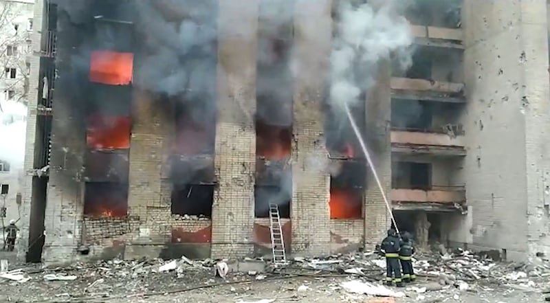 Firefighters at work after air strikes hit residential buildings in Chernihiv, northern Ukraine. AFP