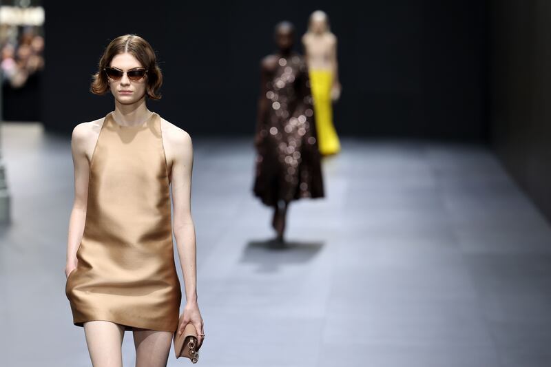 A burnished gold mini dress at the Valentino womenswear spring/summer 2023 show. Getty 