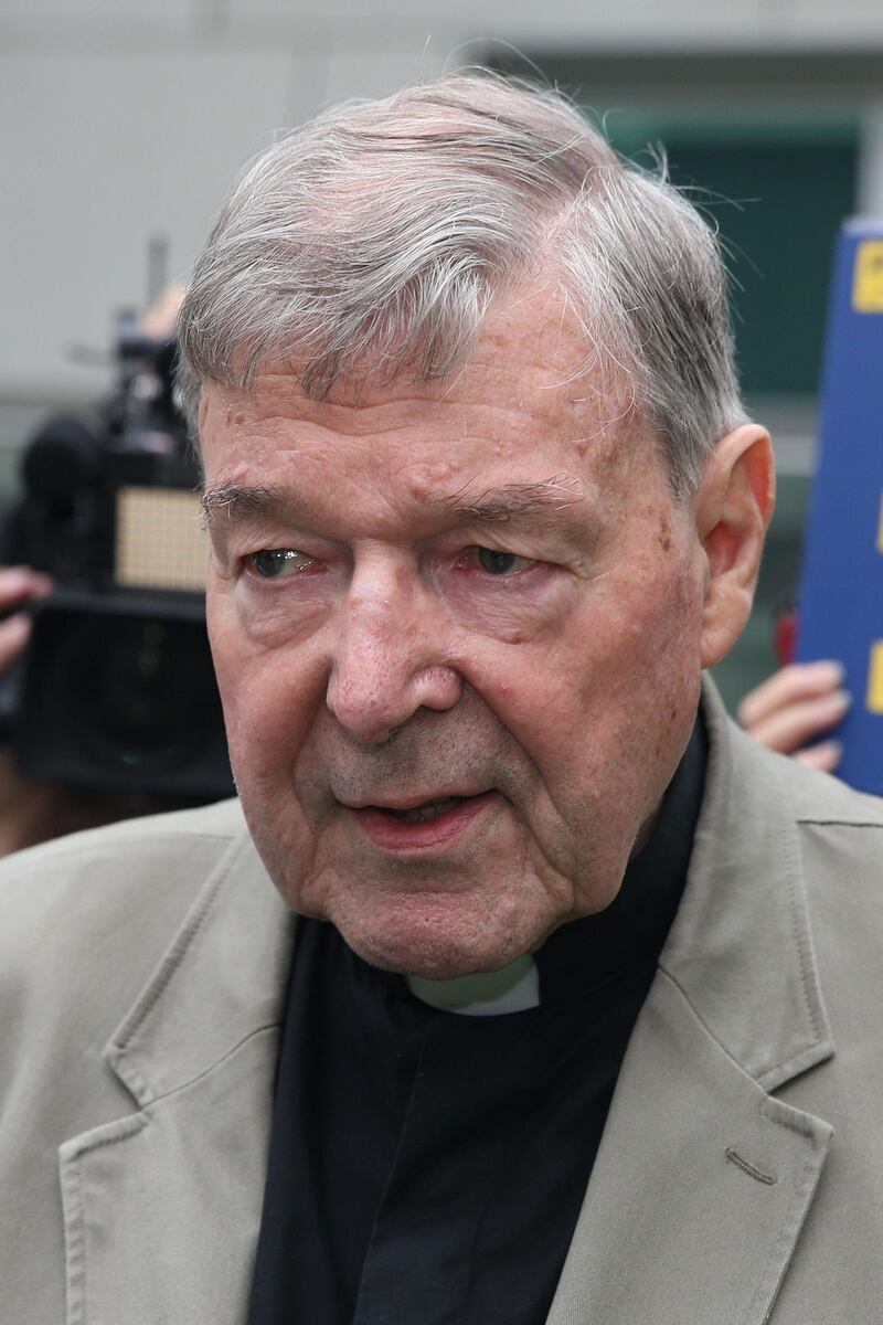 (FILES) This file photo taken on February 26, 2019 shows Cardinal George Pell leaving the County Court of Victoria court after prosecutors decided not to proceed with a second trial in Melbourne. Cardinal George Pell was aware of child sexual abuse by Catholic clergy in Australia as far back as the 1970s and failed to seek the removal of accused priests, according to parts of a top-level inquiry released on May 7, 2020. / AFP / Con CHRONIS
