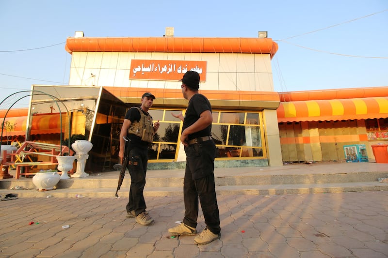 Iraqi security forces inspect the site of a bomb attack in a restaurant in the southern Iraqi city of Nassiriya, Iraq, September 14, 2017. REUTERS/Essam Al-Sudani