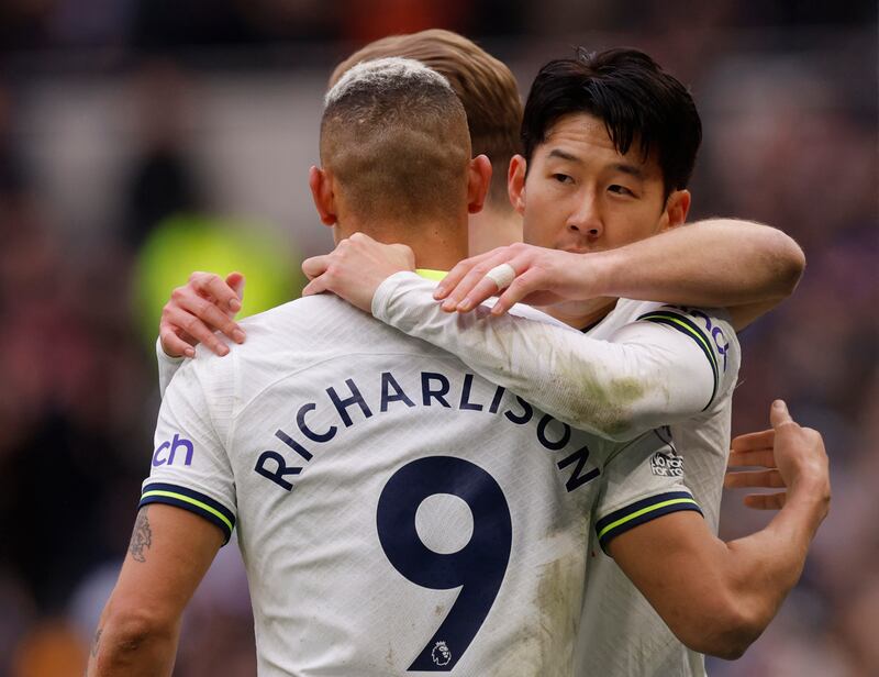 Son Heung-min celebrates scoring Tottenham's third goal with Harry Kane and Richarlison. Action Images