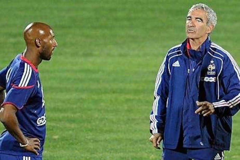 France's Nicolas Anelka exchanges words with coach Raymond Domenech during the World Cup.