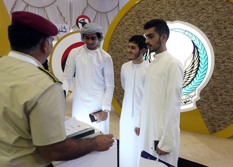 (L to R) Mohammed Al Naabi, Mohammed Al Hosani and Ali Al Hammadi applies for jobs at the GHQ Armed Forces. Satish Kumar / The National
