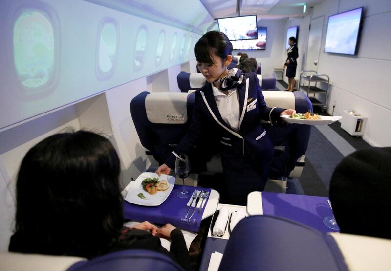 Guests experience a two hour flight on Japan's "First Airlines" without ever taking off. All photos by Toru Hanai / Reuters
