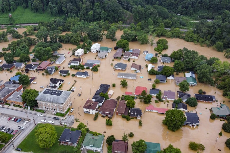 Homes submerged under flood waters from the North Fork of the Kentucky River in Jackson, Kentucky, on July 28, 2022.  AFP