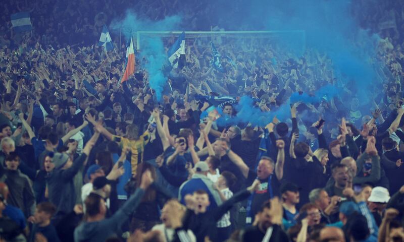 Everton fans invade the pitch after the match as they celebrate avoiding relegation from the Premier League. Reuters