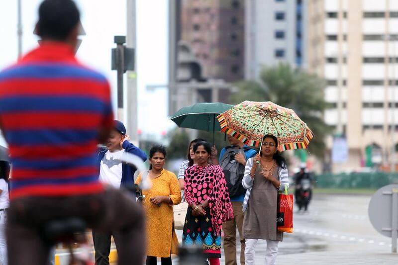 The first day of April brought rain throughout the day in Abu Dhabi as residents braved the cooler temperatures and wet conditions on Friday. Delores Johnson / The National