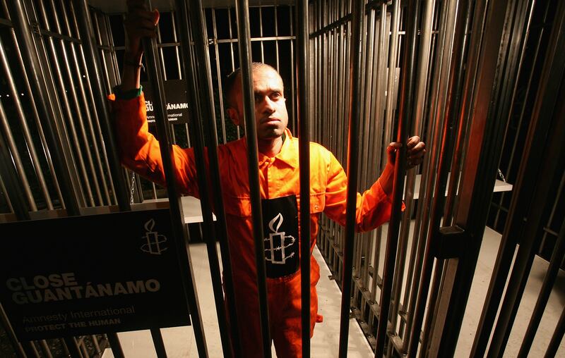 Amnesty International supporters hold a night-long vigil in a cage outside the embassy in 2008, to mark the six-year anniversary of the first prisoners being transported to Guantanamo Bay in Cuba. Getty Images
