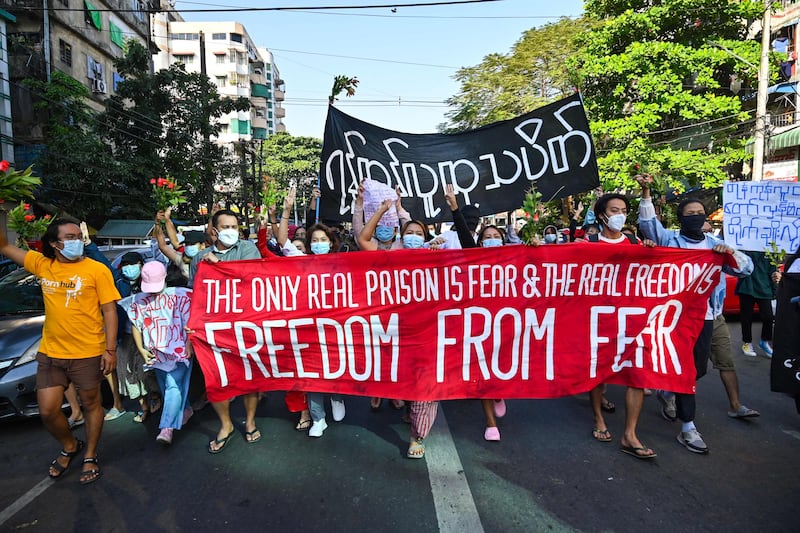 Protesters take part in a demonstration against the military in Yangon, Myanmar, on Sunday. Protests are continuing despite the deaths of more than 1,300 people since a February 1 coup. Photo: AFP