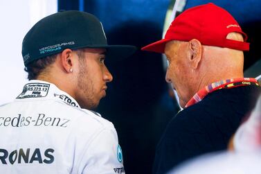 epa07588991 (FILE) - British Formula One driver Lewis Hamilton (L) of Mercedes AMG GP talks to former Formula One world champion Niki Lauda (R) after the second practice session of the Australian Formula One Grand Prix at the Albert Park circuit in Melbourne, Australia, 14 March 2014 (re-issued 21 May 2019). According to media reports on 21 May 2019, Austrian Formula One legend Niki Lauda died on 20 May 2019 at the age of 70. Lauda won the Formula One championship in 1975, 1977, and 1984 and founded three airlines. EPA/DIEGO AZUBEL *** Local Caption *** 51282598