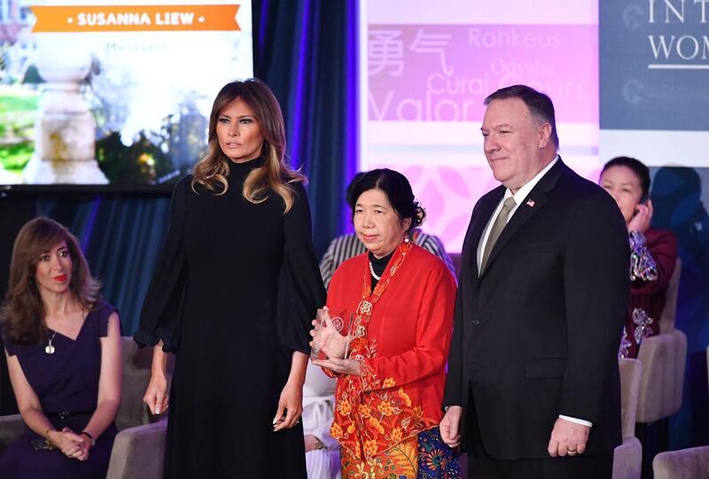 International Women of Courage  Award recipient Susanna Liew of Malaysia poses with US Secretary of State Mike Pompeo and First Lady Melania Trump.  AFP