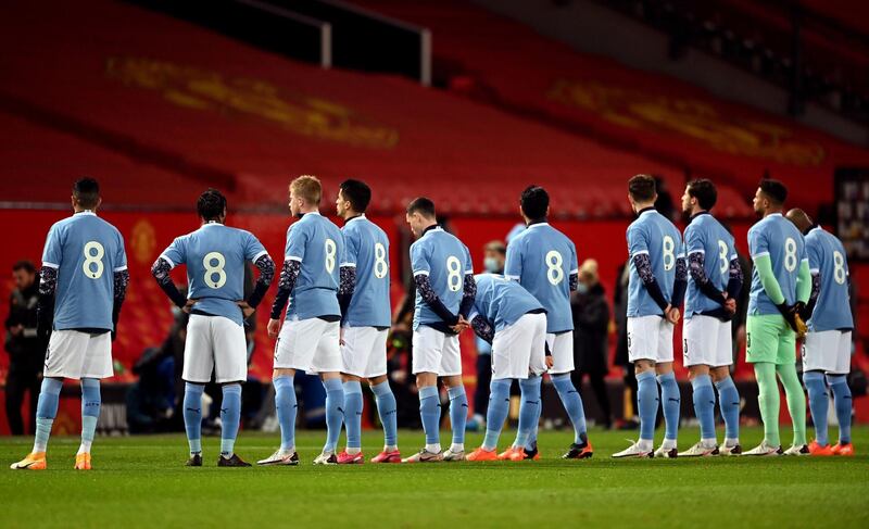 Manchester City players walk out in tribute No 8 shirts in memory of Colin Bell. PA