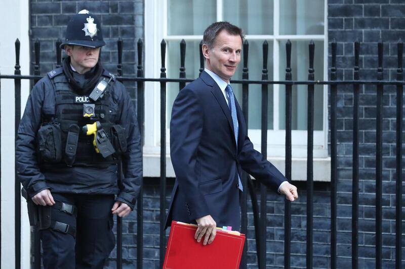 Britain's Foreign Secretary Jeremy Hunt arrives for the weekly cabinet meeting at 10 Downing Street in London on February 26, 2019. Prime Minister Theresa May faced the threat Tuesday of more ministerial resignations over her refusal to rule out the possibility of Britain crashing out of the European Union without a deal on March 29. / AFP / Daniel LEAL-OLIVAS
