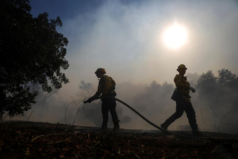 Firefighters battle the Peak Fire in Simi Valley. Reuters