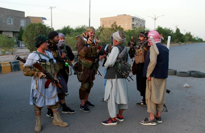 Members of the militia loyal to Ismail Khan, a former Mujahideen commander, congregate in Afghanistan's Herat province. AP