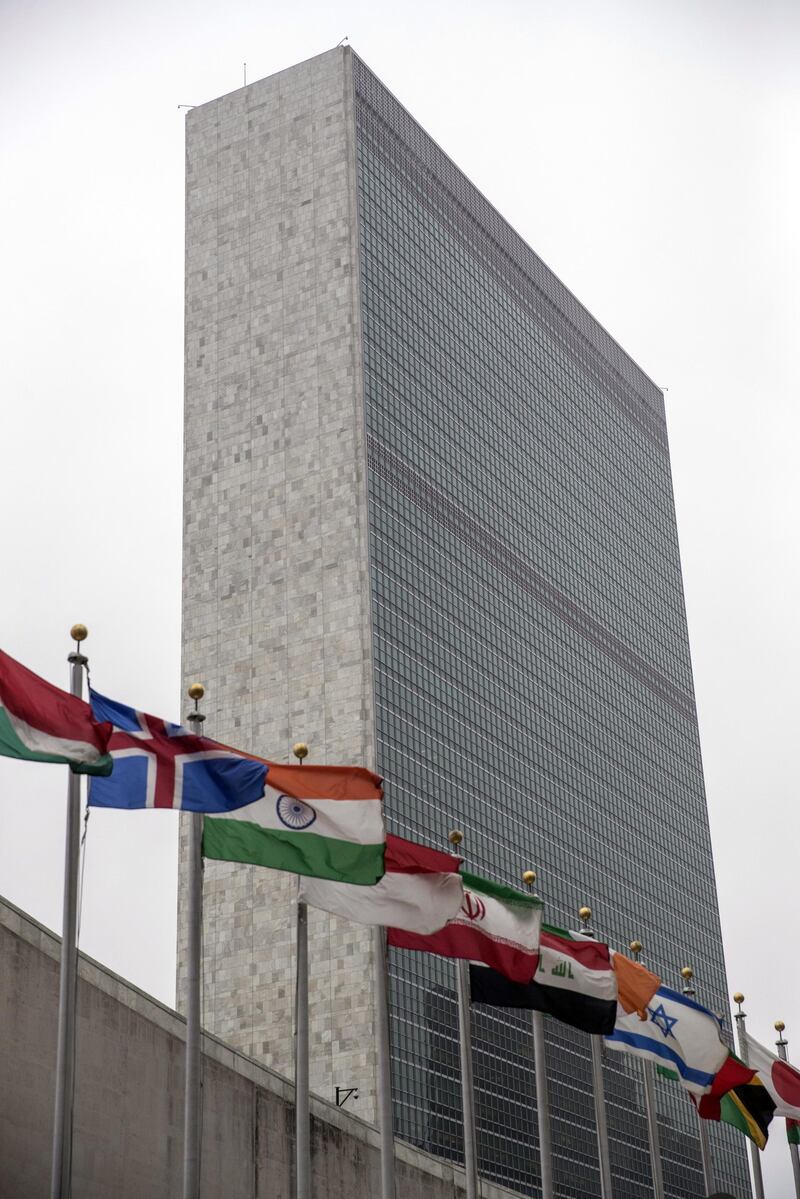 International flags fly outside the Secretariat building at the United Nations (UN) headquarters in New York, U.S., on Friday, April, 27, 2018. Donald Trump seems set on pulling out of the Iran nuclear deal next week, with U.S. officials suggesting that any initial diplomatic turbulence will be followed by negotiations for a new accord. Photographer: Victor J. Blue/Bloomberg