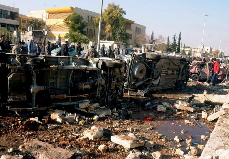 In this photo released by the Syrian official news agency SANA, Syrian people gather at the site after an explosion hit a university in Aleppo, Syria, Tuesday, Jan. 15, 2013. Two explosions struck the main university in the northern Syrian city of Aleppo on Tuesday, causing an unknown number of casualties, state media and anti-government activists said. There were conflicting reports as to what caused the blast at Aleppo University, which was in session Tuesday. (AP Photo/SANA) *** Local Caption ***  Mideast Syria.JPEG-07c73.jpg