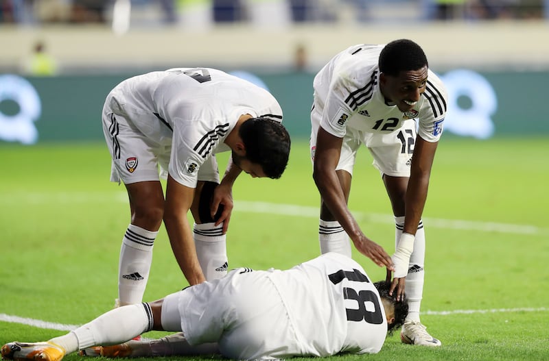 UAE's Abdullah Ramadan on the ground after being fouled in the box that resulted in a Mabkhout scoring a penalty.