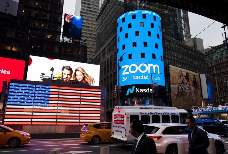 File-This April 18, 2019, file photo shows a Zoom ad, in New York. Zoomâ€™s videoconferencing service remains a fixture in pandemic life, but its breakneck growth is showing signs of tapering off as investors debate whether the company will be able to build upon its recent success after a vaccine enables people to intermingle again. Zoom highlighted its head-spinning success story again Monday, Nov. 30, 2020, with the release of its quarterly results for the August to October period. (AP Photo/Mark Lennihan, File)